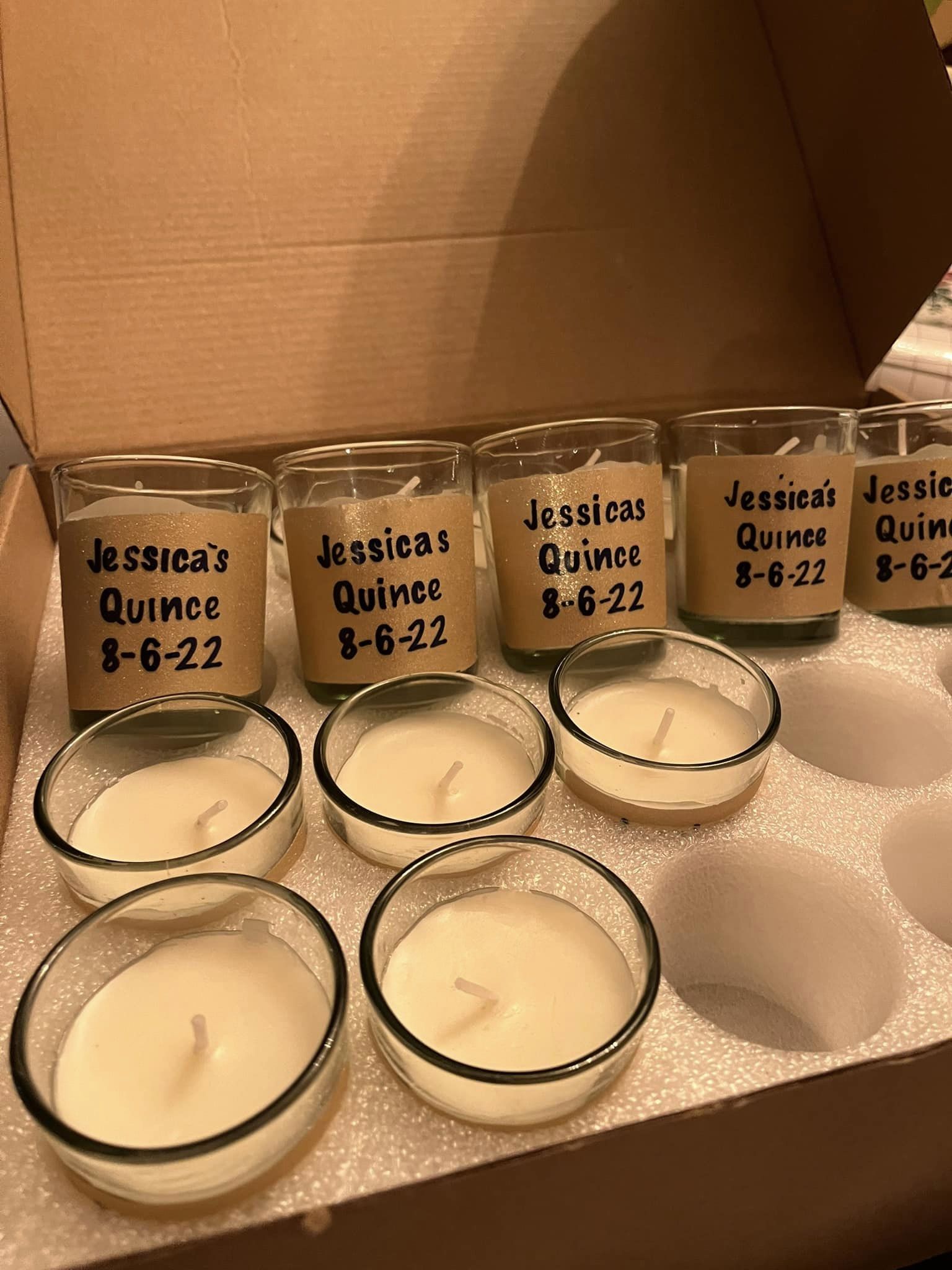 custom candles showing the name and date of a girl's quince