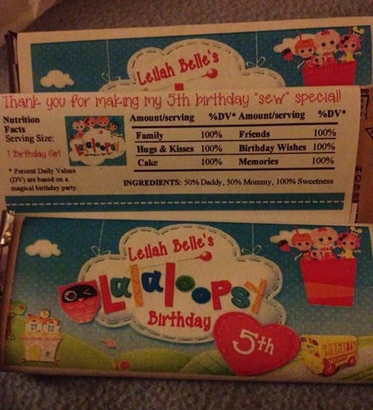 A chocolate bar with custom wrapping themed for a child's lalaloopsy themed birthday